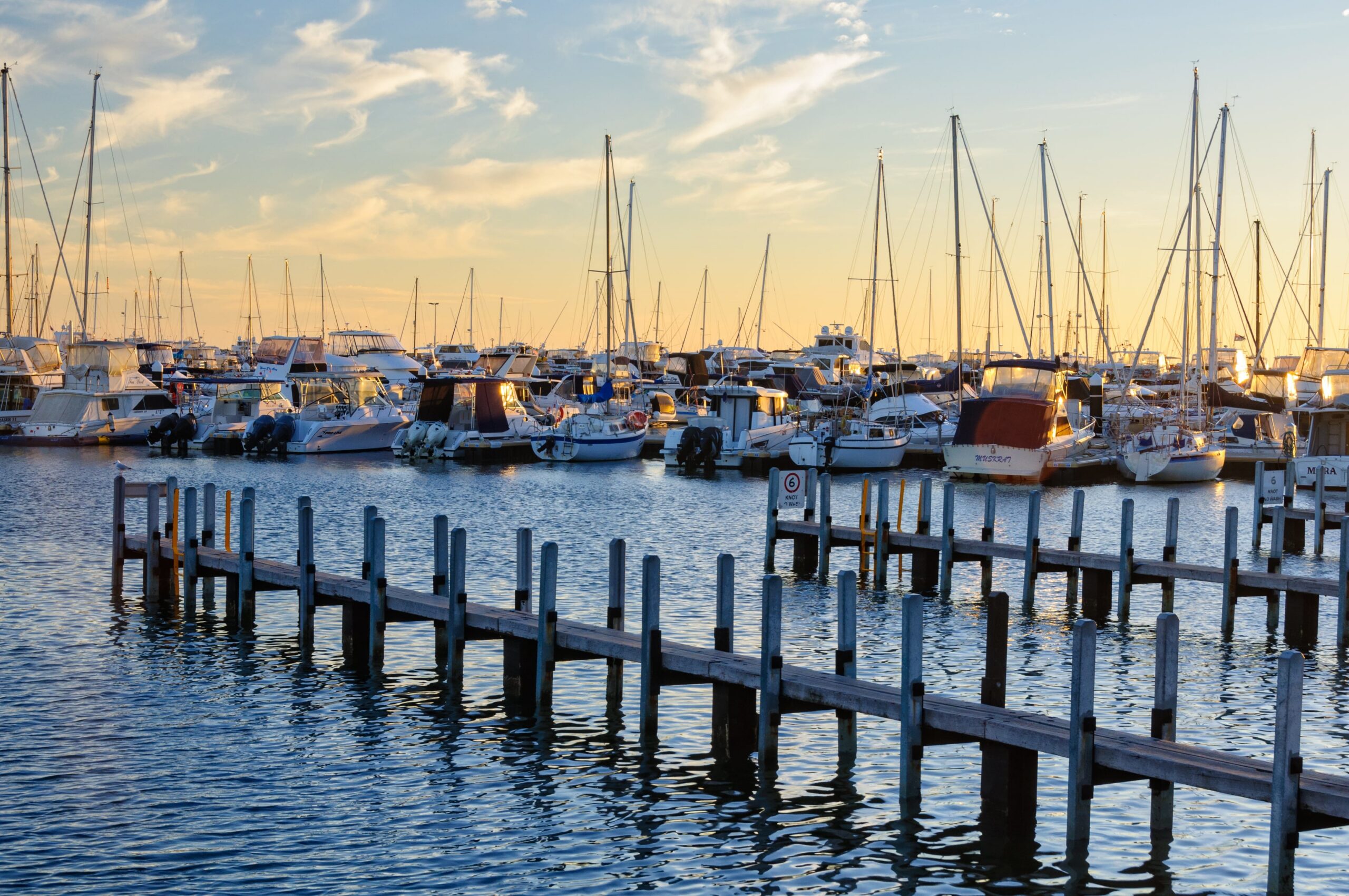 Boats moored at sunset in a marina