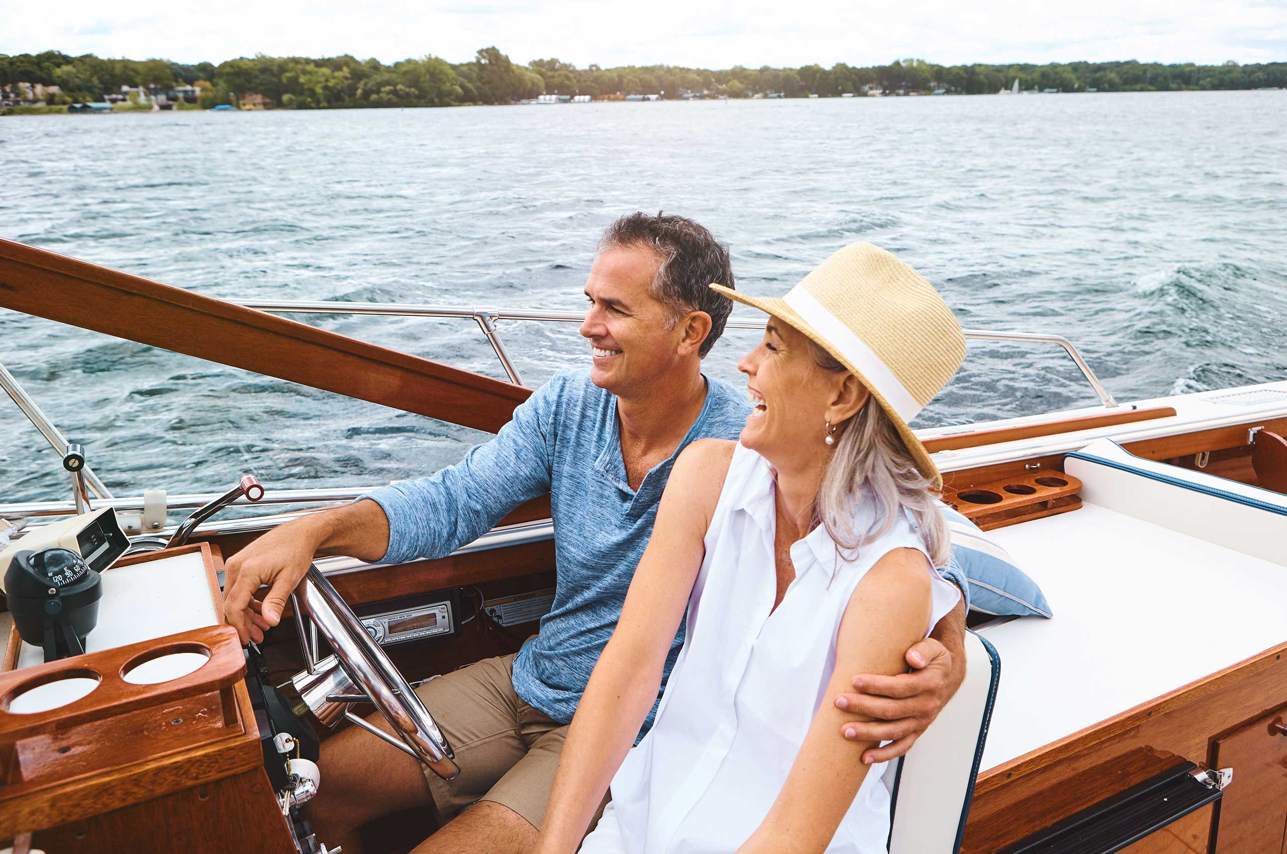 Mature couple enjoying a relaxing boat ride.